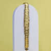 Gold bracelet featuring a series of coin-shaped designs linked together.